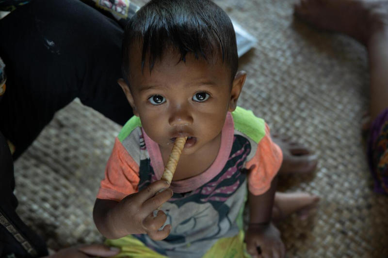 Child eats Ready to Use Therapeutic food from Fish-base, Siem Reap, Cambodia. Photo: WFP/Arete/Cesar Lopez