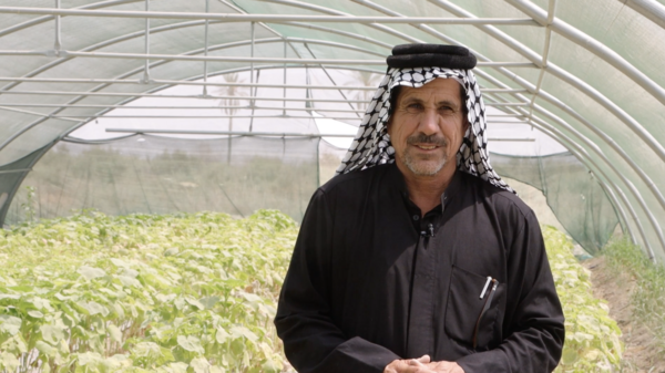 Jermal tends to his heat-affected plants. Photo: WFP/Photolibrary