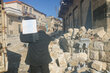 A man carries WFP food rations in Syria's quake-hit Idlib Governorate