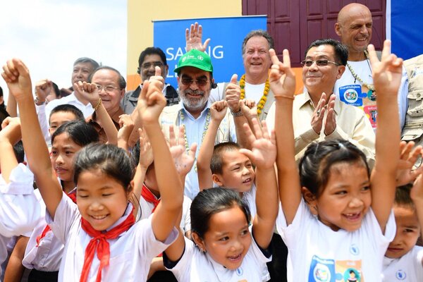 handing over our school feeding programme to the Laotian government