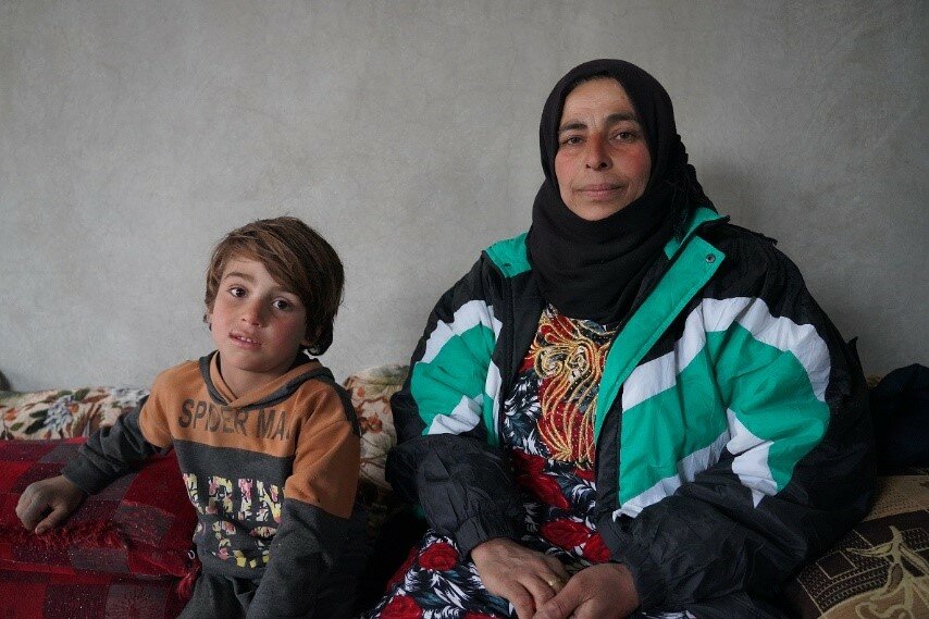 Woman and boy in Syria