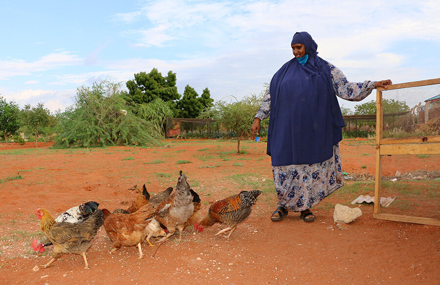 Habiba is pictured with her chickens