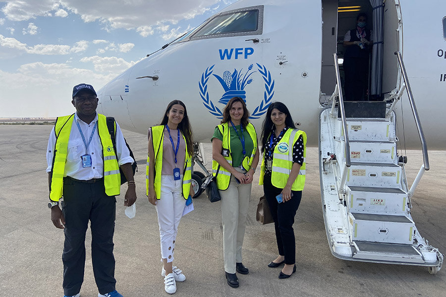 Rasha works closely with colleagues visiting from Damascus. Photo: WFP/Manal Alkalaji