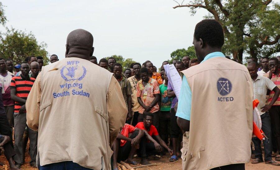 WFP and implementing partner ACTED staff at a road building project in Kuajiena last October. Photo: WFP/Eulalia Berlanga