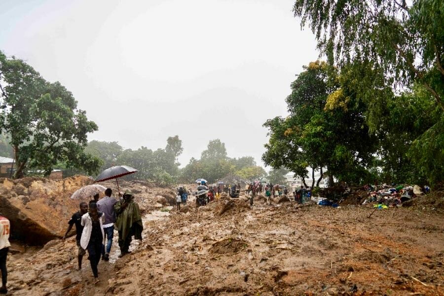 People slog through mud after Cyclone Freddy devastated parts of southern Malawi. Photo: WFP/Francis Thawani