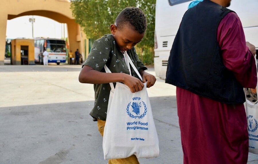 In Egypt, a young displaced boy checks out WFP's food assistance. Photo: WFP/Photo Library