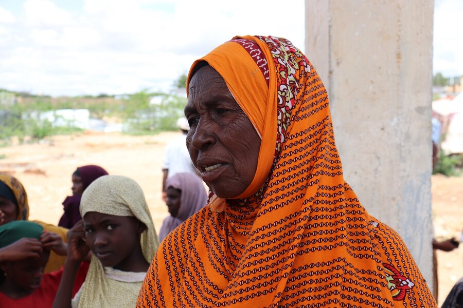 a woman in a bright orange headscarf at Iftin camp for displaced people in Somalia