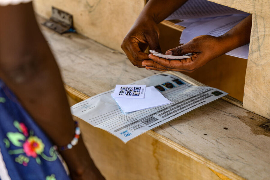 A Sahel asylum seeker receives WFP assistance. Tens of thousands of people have fled armed violence in the region, heading to more stable countries in coastal West Africa. Photo: WFP/Richard Mbouet 