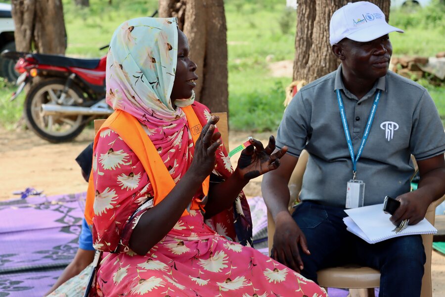 In Chad, Amsinine Radiane, here with a WFP employee, has seen her millet harvest grow sixfold. Her husband no longer migrates in search of work. Photo: WFP/Asma Achahboun