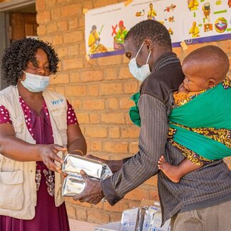 Wyson, Chifundo's uncle collects fortified flour as a dietary supplement. 
